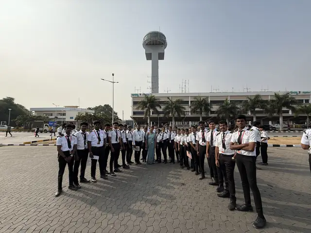 Aviation students lined up near the airport control tower